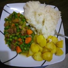 A picture of Beef n peas stew served with rice and Rosemary potatoes.