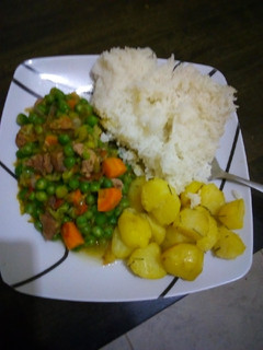 A picture of Beef n peas stew served with rice and Rosemary potatoes.