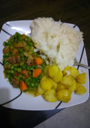 A picture of Beef n peas stew served with rice and Rosemary potatoes.