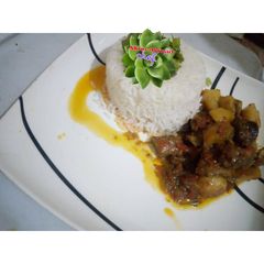 A picture of White rice and potato stew.