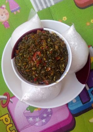 A picture of Rice swallow/vegetable soup.
