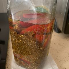A picture of Stuffed red chilli pickle.