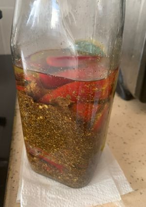 A picture of Stuffed red chilli pickle.
