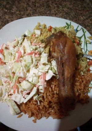 A picture of Coslo salade, jollof rice and fried rice.