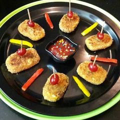 A picture of Rice Sweet Corn Bites with Tomato sauce.