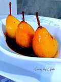 Peras confitadas en salsa de frutos rojos y agua de azahar