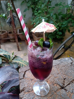 A picture of Grapes black grapes Mojito.
