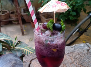 A picture of Grapes black grapes Mojito.
