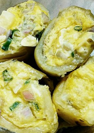 A picture of Egg stuffed potatoes.