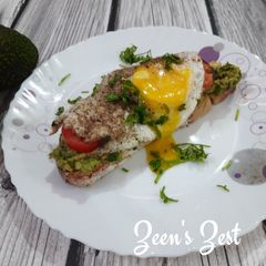 A picture of Avocado Sourdough Open Sandwiches with Sunny Side Up Egg.