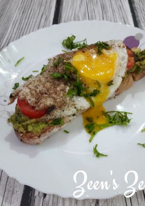 A picture of Avocado Sourdough Open Sandwiches with Sunny Side Up Egg.