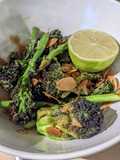 Stir-fry purple sprouting broccoli with toasted almonds and lime