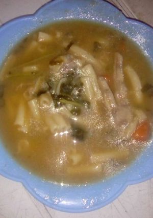 A picture of Brown beans soup with chicken feet.