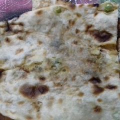 Paneer stuffed naan A picture of Paneer stuffed naan.
