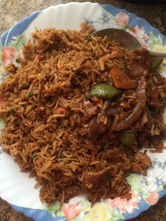 A picture of Chicken rice and wet fried beef.