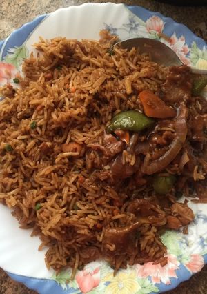 A picture of Chicken rice and wet fried beef.