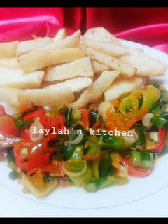 A picture of Fried Yam with vegetable sauce.