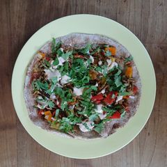 A picture of Vegan gyros on flatbread.