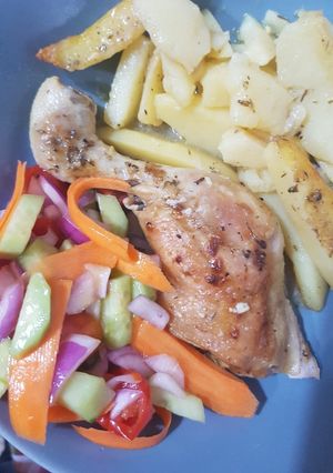 A picture of Lemony Baked Chicken Drumsticks with Potatoes.