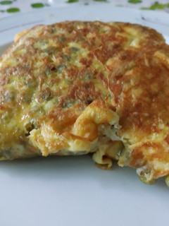 Una foto de Tortilla de arvejas y queso