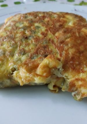 Una foto de Tortilla de arvejas y queso