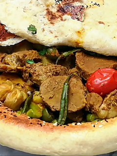 A picture of Beef Stew Covered With Bread.