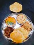 Ashtami Puja Bhog Thali (Kala Chane ka prasad with Halwa puri and Kheer Prasad)