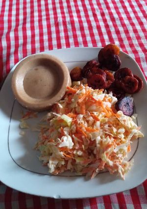 A picture of Moimoi,coleslaw and fried plantain.
