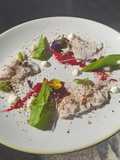 Paperbark smoked crocodile entree with wattleseed beetroot puree