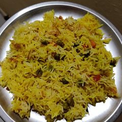 A picture of Peas Pulao in pressure cooker.