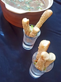 A picture of Bread sticks with shangrila soup.