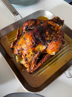 A picture of Garlic Butter Roast Chicken with herbs.