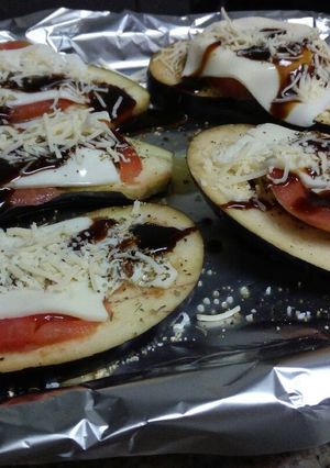 Una foto de Berenjenas con queso, Módena y miel al horno