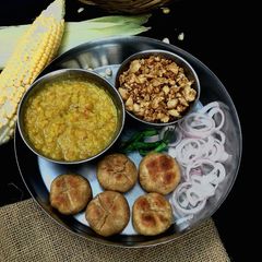 A picture of Dal bati churma.