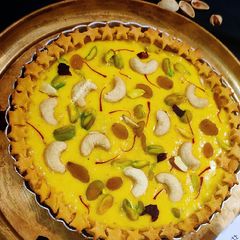 A picture of Mango Rabari with Besan Tart.