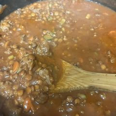 A picture of Italian spicy sausage and lentil soup.