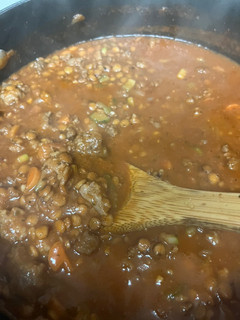 A picture of Italian spicy sausage and lentil soup.