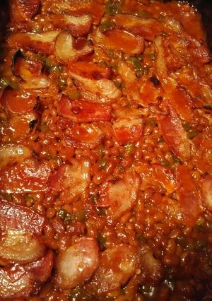 A picture of Baked Beans with bell pepper and bacon.