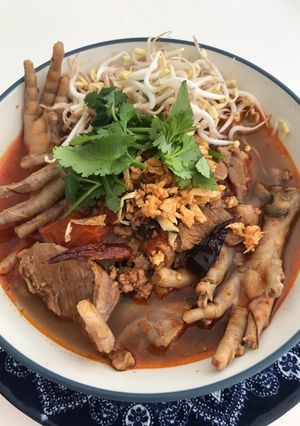 A picture of Khanom Jeen Nam Ngiao with Chicken Feet.