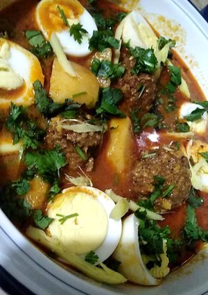 A picture of Alu kofta curry with eggs..