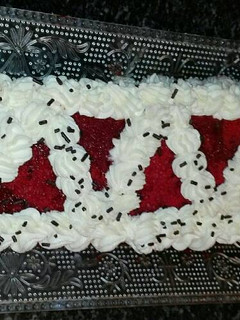 Foto principal de Brazo de terciopelo rojo relleno de buttercream de queso