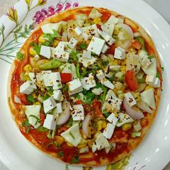 A picture of Sattu Powder Cheese Pizza (Desi style).