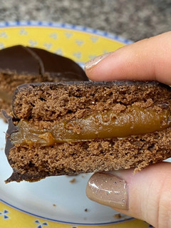 Una foto de Alfajores - Copitos de dulce de leche bañados en chocolate 🤍