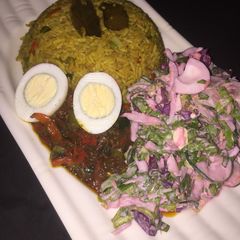 A picture of Fried rice with beetroot salad.
