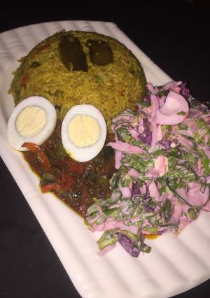 A picture of Fried rice with beetroot salad.