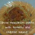 Elbow macaroni pasta with tomato and cheese sauce