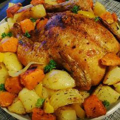 A picture of Roast chicken and veggies.