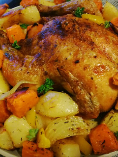 A picture of Roast chicken and veggies.