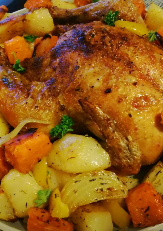A picture of Roast chicken and veggies.