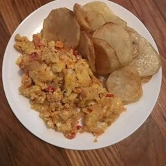 A picture of Scrambled Eggs and Fried Irish Potato.